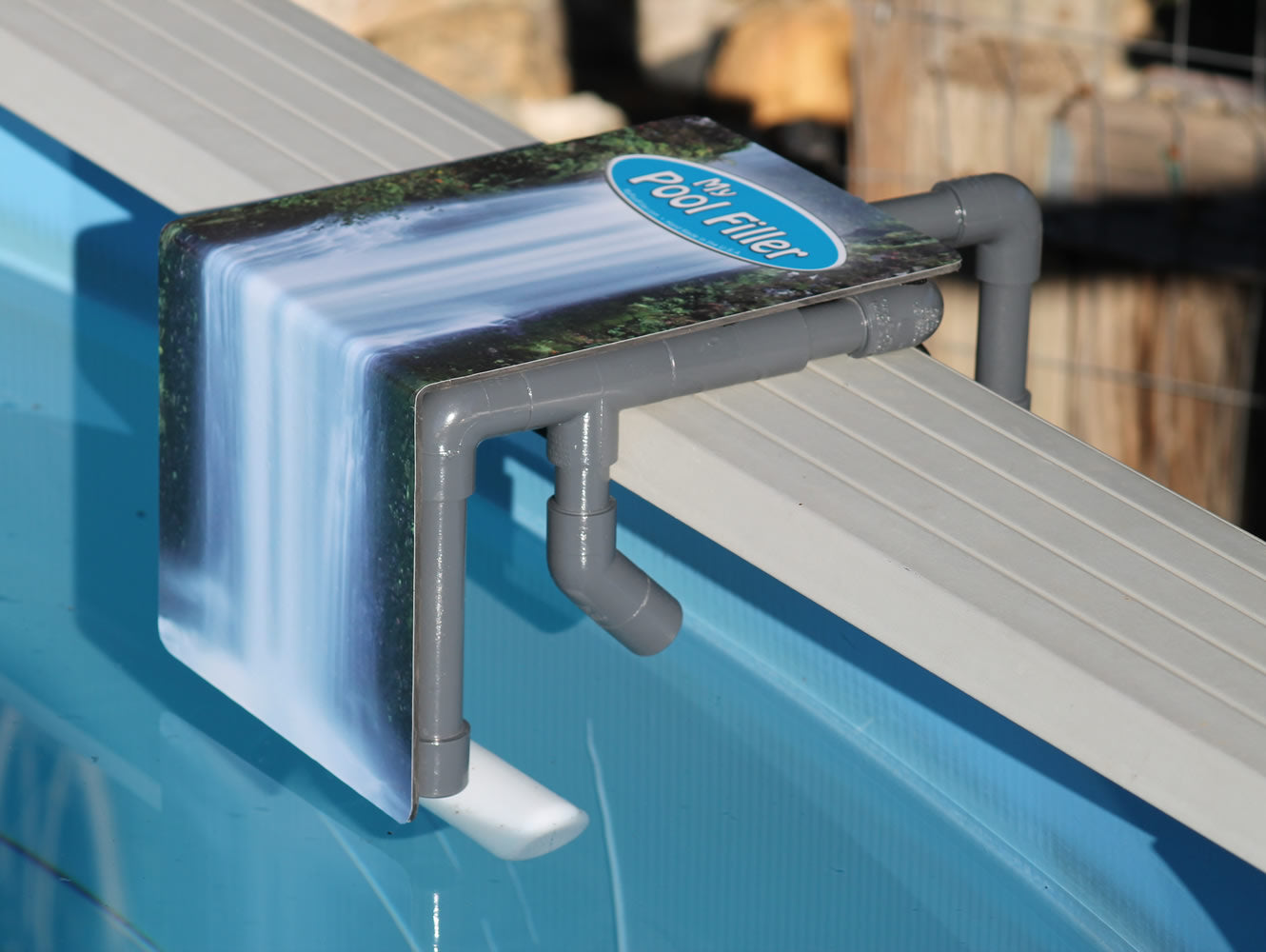 Above-ground pool with automatic water leveler installed – side view